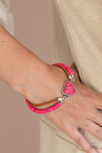 Paparazzi Charmingly Country - Pink - Set  -  A vivacious pink stone heart frame attaches to strands of brown suede and pink stone beads, creating a charming centerpiece around the wrist. Features an adjustable clasp closure.