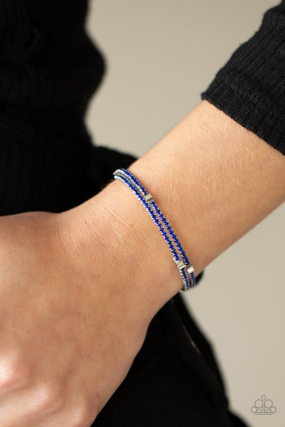 Paparazzi Let Freedom BLING - Blue - Bracelet  -  Dotted with dainty silver star charms, a bendable row of glittery blue rhinestones spirals around the wrist, creating a sparkly infinity wrap bracelet.
