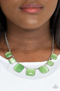 Paparazzi Aura Allure - Green - Necklace  -  Encased in square silver fittings, a dewy collection of green cat's eye stones gradually increase in size as they link below the collar for a whimsical pop of color. Features an adjustable clasp closure.
