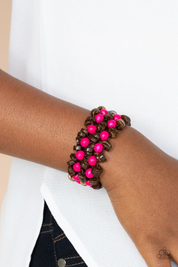 Paparazzi Tahiti Tourist - Pink - Bracelet  -  Rows of pink wooden beads and brown wooden discs are threaded along stretchy bands that decoratively weave around the wrist, creating a tropical inspired statement piece.
