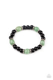 Paparazzi Unity - Green - Bracelet  -  Infused with dainty silver accents, glassy black and green stone beads are threaded along a stretchy band around the wrist for a stackable seasonal look.

