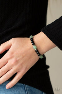 Paparazzi Unity - Green - Bracelet  -  Infused with dainty silver accents, glassy black and green stone beads are threaded along a stretchy band around the wrist for a stackable seasonal look.
