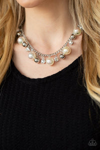Paparazzi Galactic Gala - White - Necklace  -  An oversized collection of shiny silver beads, white rhinestone accents, and iridescent pearls dangle from a classic silver chain, creating a stellar fringe below the collar. Features an adjustable clasp closure.
