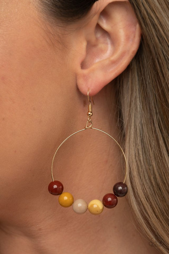 Paparazzi Let It Slide - Multi - Earrings  -  An oversized collection of earthy stones slide along the bottom of a dainty gold hoop, creating an earthy centerpiece. Earring attaches to a standard fishhook fitting.
