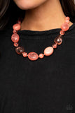 Paparazzi Staycation Stunner - Orange - Set  -  Featuring glassy, opaque, and solid finishes, an array of Burnt Coral faux stone beads and dainty silver beads are threaded along an invisible wire below the collar, creating a colorful statement piece. Features an adjustable clasp closure.