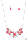 Paparazzi Extra Eloquent - Pink - Necklace  -  A mismatched collection of faceted pink beaded frames and white rhinestone embellished accents delicately connect into a bubbly clustered pendant below the collar, creating a colorful statement piece. Features an adjustable clasp closure.
