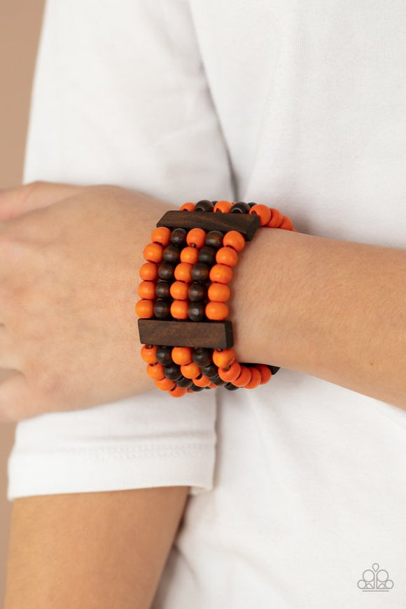 Paparazzi Caribbean Catwalk - Orange - Bracelet  -  Held in place by rectangular wooden frames, strands of brown and orange wooden beads are threaded along stretchy bands around the wrist for a colorfully tropical look.
