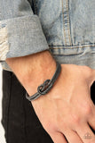 Paparazzi Nautical Grunge - Black - Bracelet  -  Gritty gunmetal cable-like bars curl around the wrist, knotting into an edgy cuff for a bold industrial look.
