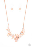 Paparazzi Fairytale Affair - Copper - Necklace  -  A bubbly collection of coppery cat's eye stones, glassy white rhinestones, and shiny copper discs delicately coalesces into enchanting frames below the collar that links into a whimsical centerpiece. Features an adjustable clasp closure.
