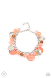 Paparazzi Springtime Springs - Orange - Bracelet  - April 2021 Fashion Fix Exclusive  -  Springtime charms of shiny and soft beads and pearl-like discs in lovely tones of Burnt Coral sway from a silver chain. Accents of sparkly, wavy silver discs and wooden beads bring it down to earth as the fringe wraps around the wrist. Features an adjustable clasp closure..
