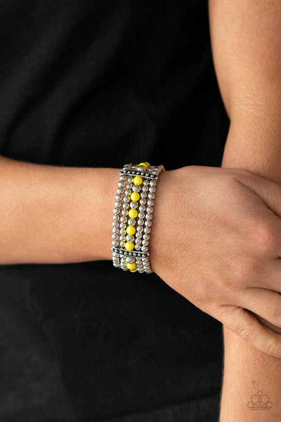 Paparazzi Gloss Over The Details - Yellow - Bracelet  -  Held together by studded silver frames, rows of silver and Illuminating beads are threaded along stretchy bands around the wrist, creating vivacious layers.
