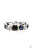Paparazzi Extra Exposure - Multi - Bracelet  -  Encased in sleek silver frames, a smoldering collection of round and emerald cut black, blue, and hematite rhinestones glide along stretchy bands around the wrist, creating a sparkly industrial statement piece.
