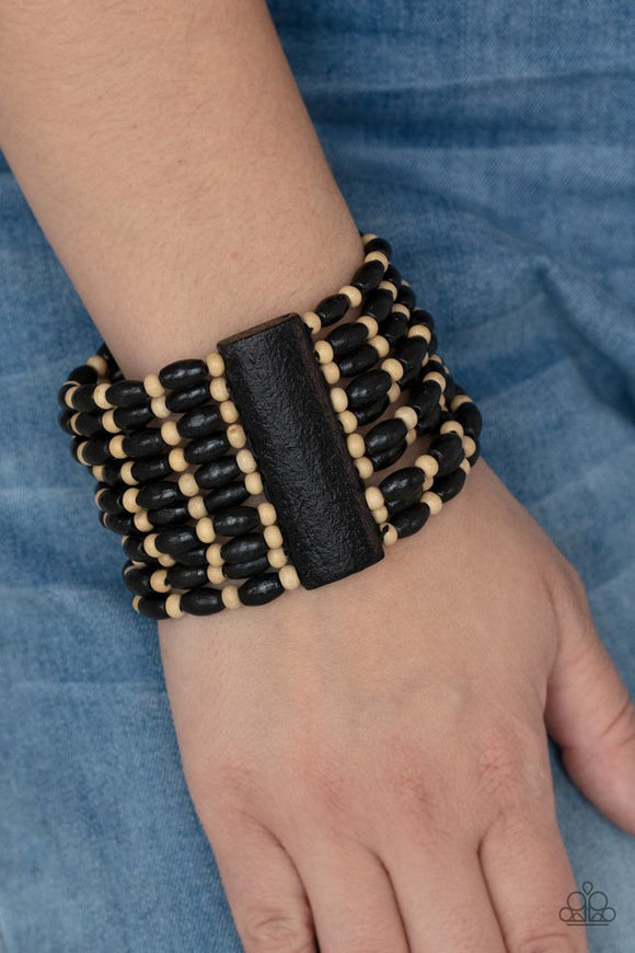 Paparazzi Cayman Carnival - Black - Bracelet  -  Held together with rectangular wooden frames, an earthy collection of white wooden beads and black oval wooden beads are threaded along stretchy bands around the wrist for a bold beach inspired fashion.
