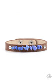 Paparazzi Pebble Paradise - Blue - Bracelet  -  A strand of blue pebbles is studded in place across the front of a skinny brown leather band, creating a colorful earthy display around the wrist. Features an adjustable snap closure.
