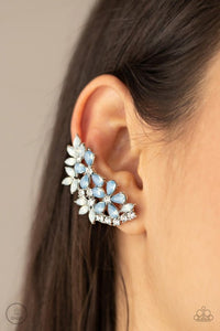 Paparazzi Garden Party Powerhouse - Blue - Earrings  -  Featuring a milky opalescence, white marquise and Cerulean teardrop rhinestones coalesce into a sparkly floral centerpiece that flawlessly climbs the ear. Earring attaches to a standard post fitting. Features a dainty cuff attached to the top for a secure fit.
