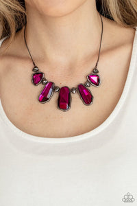 Paparazzi Cosmic Cocktail - Pink - Necklace  -  A glittery collection of raw cut pink gems delicately link with dainty hematite rhinestone dotted gunmetal teardrops below the collar, creating a stellar fringe. Features an adjustable clasp closure.
