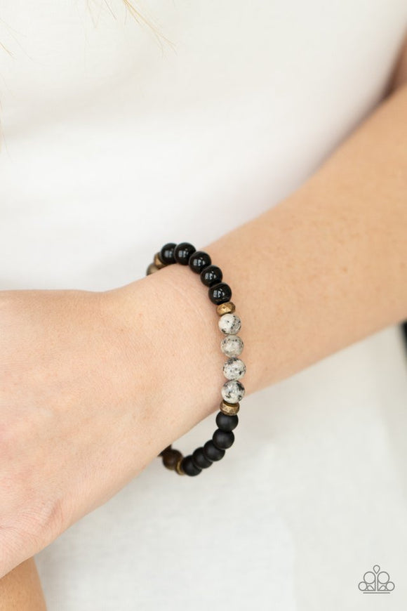 Paparazzi Petrified Powerhouse - Multi - Bracelet  -  A collection of smooth round stones punctuated by faceted antiqued brass beads are threaded along a stretchy band and wrap around the wrist for an elementally earthy effect.

