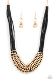 Paparazzi Lock, Stock, and SPARKLE - Gold - Necklace  -  Bold and unapologetic, this hefty necklace gives off a hand-made feel with its multiple strands of black cording held together by industrial gold fittings that shift and slide. Features an adjustable clasp closure.

