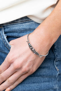Paparazzi Bubbling Whimsy - Multi - Bracelet  -  A cluster of engraved and antiqued silver swirls merge with colorful rhinestones and coalesce into a whimsical display across the wrist on a dainty silver cuff. Features a hook and eye closure.
