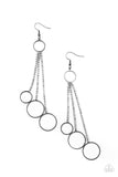 Paparazzi Demurely Dazzling - Black - Earrings  -  Dainty gunmetal hoops swing from the bottom of glittery strands of glassy white rhinestones that attach to the bottom of a dainty gunmetal ring, creating a tantalizing tassel. Earring attaches to a standard fishhook fitting.

