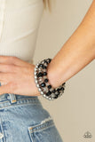 Paparazzi Gimme Gimme - Black - Bracelet  - 2021 Convention Exclusive  -  Sections of shiny silver beads and an alternating pattern of smoky and glittery black rhinestone gems gradually increase in size along a coiled wire, creating a jaw-dropping infinity wrap bracelet around the wrist.
