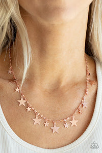 Paparazzi Starry Shindig - Copper - Necklace  -  Varying in size, dainty shiny copper stars alternate along a decorative shiny copper chain, creating a stellar fringe below the collar. Features an adjustable clasp closure.
