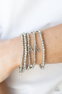 Paparazzi American All-Star - Silver - Bracelet  -  Infused with dainty silver star beads and shiny silver star charms, strands of silver beaded stretchy bands stack across the wrist, creating a patriotic shimmer.
