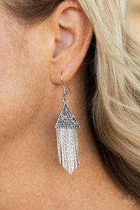Paparazzi Pyramid SHEEN - Silver - Earrings  - 2021 Convention Exclusive  -  Encrusted in dainty hematite rhinestones, a silver triangle frame gives way to a tapered fringe of flat silver chains for a smoldering effect. Earring attaches to a standard fishhook fitting.
