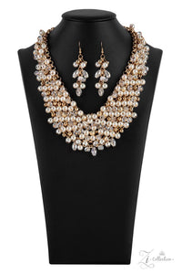 Paparazzi Sentimental - 2021 Zi Signature Collection  -  Mesmerizingly mismatched crystal-like beads, white pearls, and classic white rhinestones delicately attach to a golden chain net below the collar. Jampacked with noise-making shimmer, the effervescently clustered fringe dances with each movement for an elegantly bubbly finish. Features an adjustable clasp closure.

