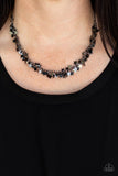Paparazzi Starry Anthem - Black - Necklace  -  A glistening collection of dainty gunmetal star charms delicately cluster on a classic gunmetal chain, creating a stellar fringe below the collar. Features an adjustable clasp closure.
