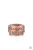 Paparazzi Dream Louder - Copper - Ring  -  The front of a thick copper band is stamped in the phrase, "Dream out loud," creating an inspirational centerpiece across the finger. Features a stretchy band for a flexible fit.
