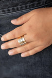 Paparazzi Dream Louder - Gold - Ring  -  The front of a thick gold band is stamped in the phrase, "Dream out loud," creating an inspirational centerpiece across the finger. Features a stretchy band for a flexible fit.
