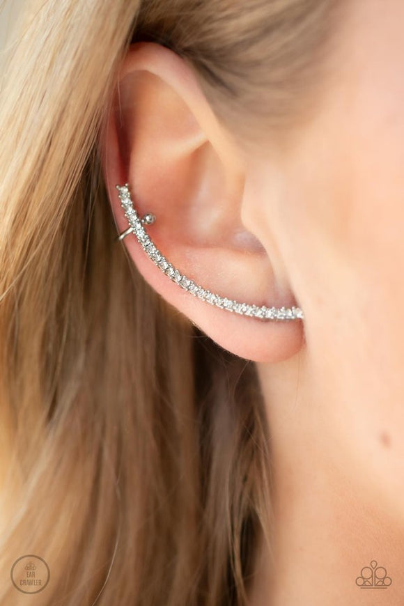 Paparazzi Sleekly Shimmering - White - Earrings  -  Featuring pronged silver fittings, a dainty row of stacked white rhinestones gently curves as it climbs the ear for a flawless fashion. Features a dainty cuff attached to the top for a secure fit.
