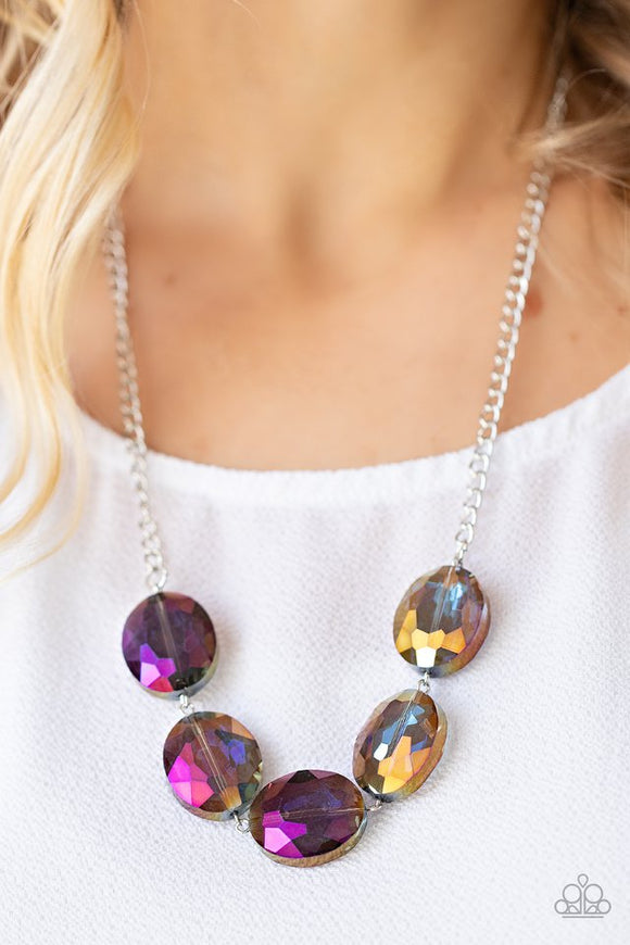 Paparazzi Cosmic Closeup - Purple - Necklace  -  Brushed in a purple oil spill finish, a faceted collection of oversized iridescent gems delicately links below the collar for a gritty glamorous look. Features an adjustable clasp closure.
