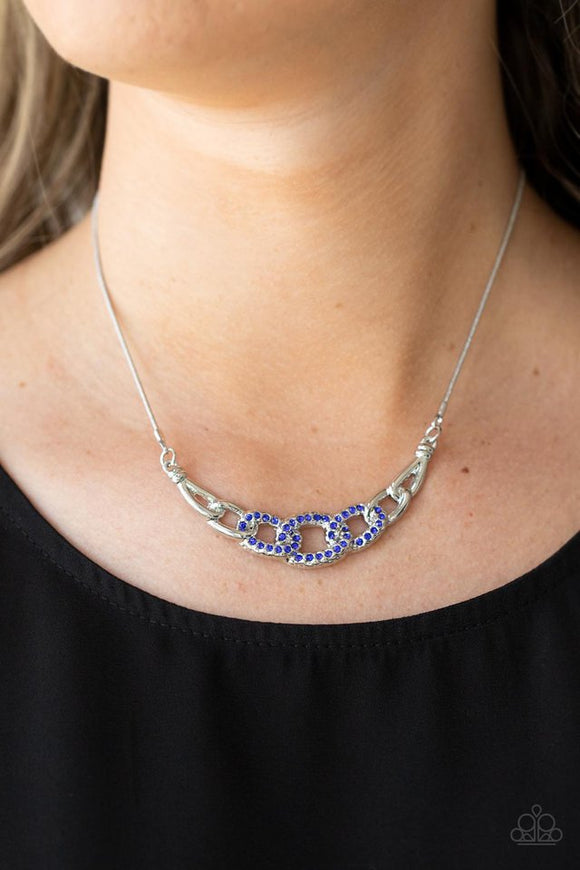 Paparazzi KNOT In Love - Blue - Necklace  -  Shiny silver links, encrusted with dainty blue rhinestones, connect into a glamorous centerpiece below the collar. Features an adjustable clasp closure.
