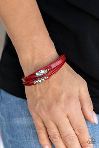 Paparazzi Tahoe Tourist - Red - Bracelet  - 2021 Convention Exclusive  -  Infused with a silver beaded accent, rows of shiny red cording join a red leather band around the wrist. A hammered silver teardrop is knotted in place with red thread, adding an artisanal touch to the colorfully rustic centerpiece. Features a magnetic closure.
