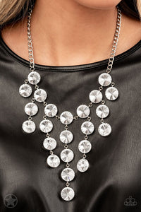 Paparazzi Spotlight Stunner - Necklace  -  Encased in sleek silver fittings, dramatically oversized white rhinestones delicately link into twinkly tassels that taper off into a jaw-dropping fringe below the collar. Features an adjustable clasp closure.
