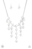 Paparazzi Spotlight Stunner - Necklace  -  Encased in sleek silver fittings, dramatically oversized white rhinestones delicately link into twinkly tassels that taper off into a jaw-dropping fringe below the collar. Features an adjustable clasp closure.
