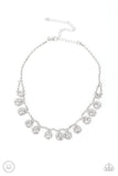 Paparazzi Princess Prominence - White - Necklace  -  A dainty strand of glittery white rhinestones encircle solitaire white rhinestones around the neck, creating a glitzy fringe. Features an adjustable clasp closure.
