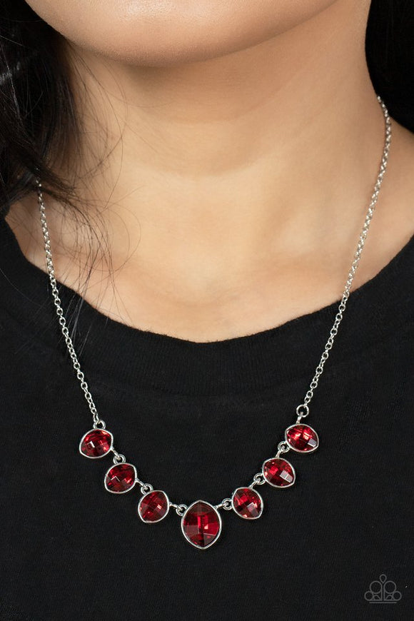 Paparazzi Material Girl Glamour - Red - Necklace  -  Encased in sleek silver fittings, elegant cut fiery red rhinestones delicately connect below the collar. An oversized red rhinestone adorns to the middle of the glittery strand, creating a sparkly centerpiece. Features an adjustable clasp closure.
