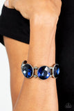 Paparazzi Powerhouse Hustle - Blue - Bracelet  -  Infused with pairs of silver beads, a glitzy collection of dramatically oversized Rhodonite rhinestone frames are threaded along stretchy bands around the wrist for a jaw-dropping dazzle.
