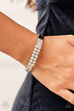 Paparazzi Doubled Down Dazzle - White - Bracelet  -  Stacked layers of brilliant white rhinestones give way to double layers of sleek silver frames that feature a subtle wave, creating a dramatically modern design around the wrist. Features a hinged closure.
