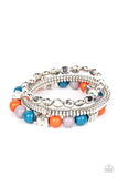 Paparazzi Tour de Tourist - Multi - Bracelet  -  A mismatched collection of silver discs, silver cubes, bubbly multicolored acrylic, and silver pebble-like beads are threaded along stretchy bands around the wrist, creating fiery layers.
