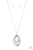 Paparazzi Industrial Infusion - White - Necklace  -  Glittery white rhinestones are haphazardly sprinkled along three asymmetrical and hammered silver ovals, creating a dizzying pendant at the bottom of an extended silver chain. Features an adjustable clasp closure.
