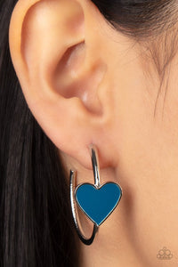Paparazzi Kiss Up - Blue - Earrings  -  A charming Mykonos Blue heart adorns the front of a classic silver hoop resulting in a whimsical fashion. Earring attaches to a standard post fitting. Hoop measures approximately 1 1/4" in diameter.

