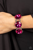 Paparazzi Powerhouse Hustle - Pink - Bracelet  -  Infused with pairs of silver beads, a glitzy collection of dramatically oversized Fuchsia Fedora rhinestone frames are threaded along stretchy bands around the wrist for a jaw-dropping dazzle.
