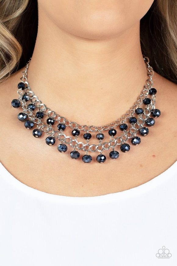 Paparazzi Urban Palace - Blue - Necklace  -  Featuring metallic iridescence, two rows of flashy blue crystal-like beads cascade from the bottom of two interlocking silver chains, resulting in a radiant fringe below the collar. Features an adjustable clasp closure.
