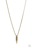 Paparazzi Highland Hunter - Brass - Necklace  -  A tribal-inspired motif wraps around a brass bullet-shaped pendant at the end of a round brass box chain resulting in a striking ancestral adornment below the collar. Features an adjustable clasp closure.
