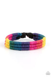Paparazzi Rainbow Renegade - Multi - Bracelet  -  Colorful sections of pink, red, yellow, green, blue, and purple cords ornately wrap and weave around three black bands, coalescing into a radiant rainbow around the wrist. Features an adjustable sliding knot closure.
