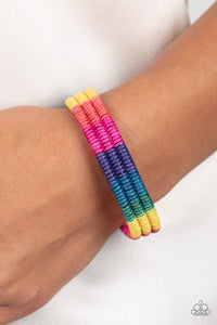 Paparazzi Rainbow Renegade - Multi - Bracelet  -  Colorful sections of pink, red, yellow, green, blue, and purple cords ornately wrap and weave around three black bands, coalescing into a radiant rainbow around the wrist. Features an adjustable sliding knot closure.
